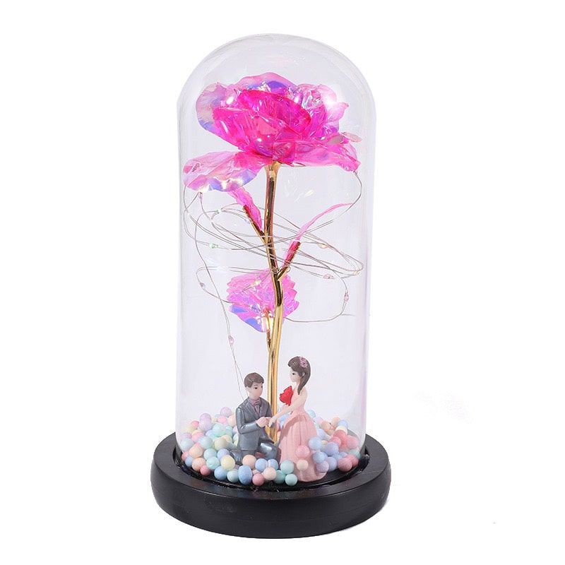 Leuchtende Rose unter Glas mit feiner Lichterkette - Liebesketten